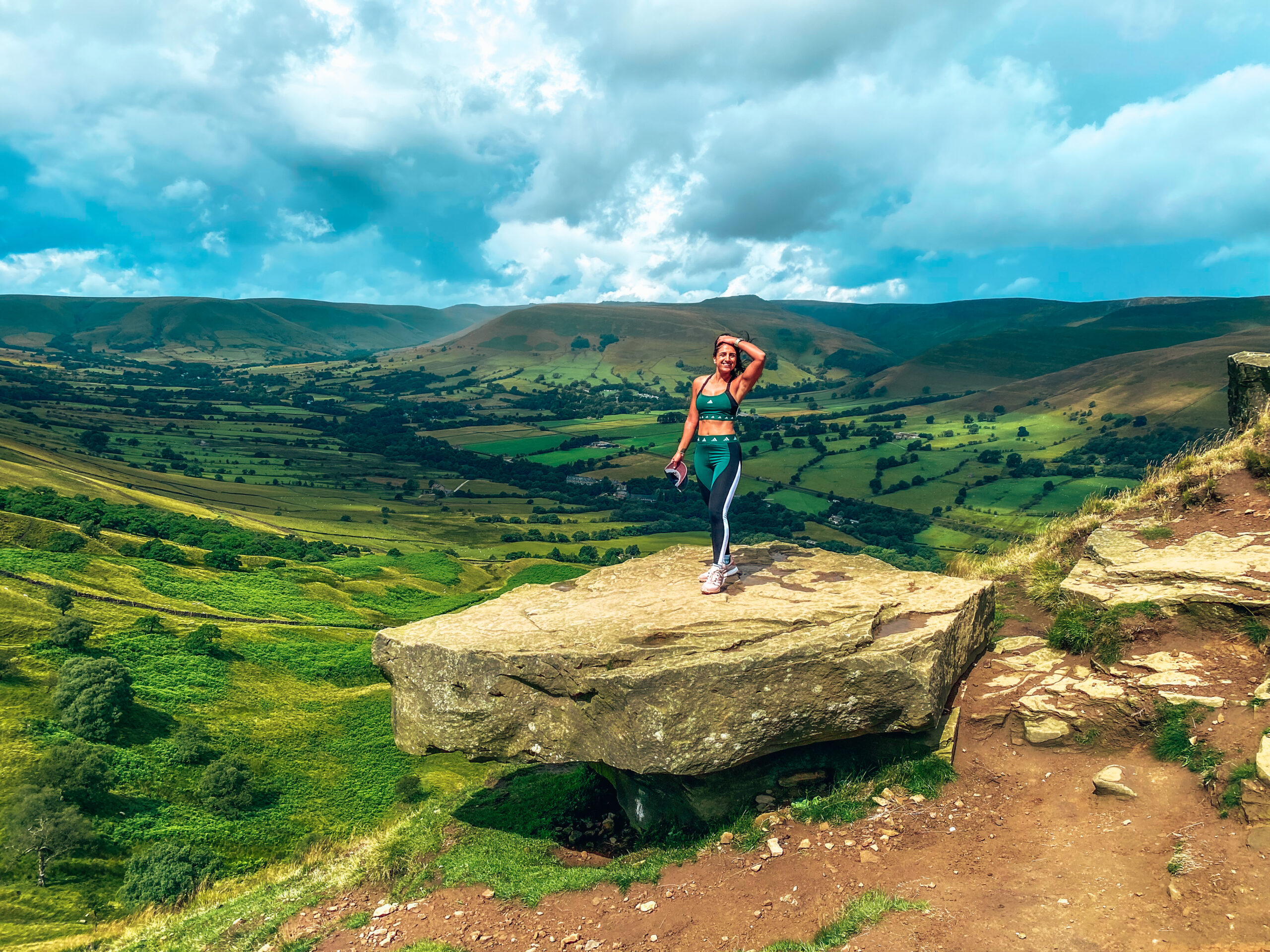 Hiking Mam Tor, Peak District. Solo female travel blogger Absolutely Lucy wearing adidas outdoor clothing, hiking shoes and waterproofs.