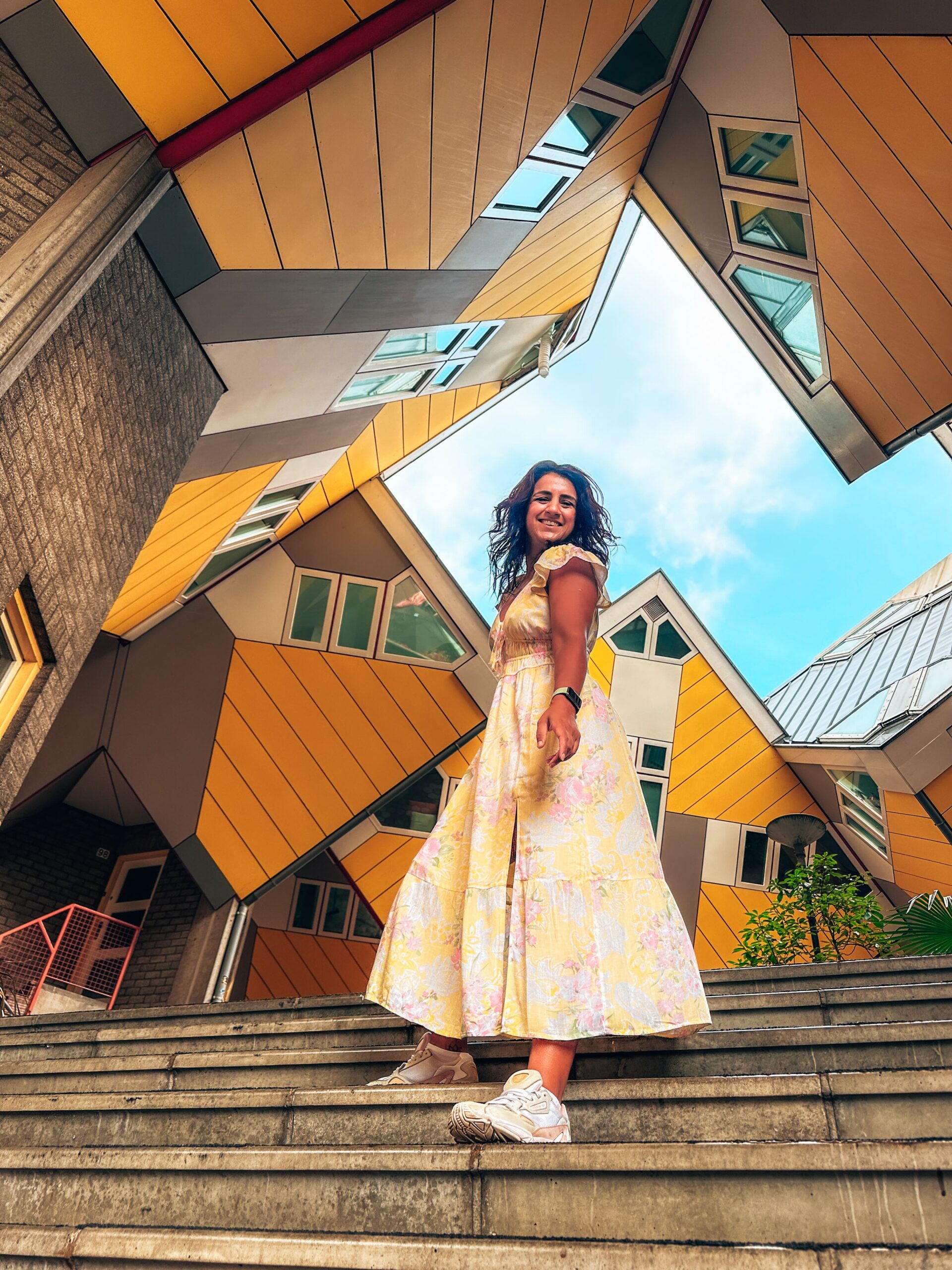 Mixed race girl explores Rotterdam in long floral dress from Hollister - pictured at the cube houses | Vintage shopping guide, second-hand shops