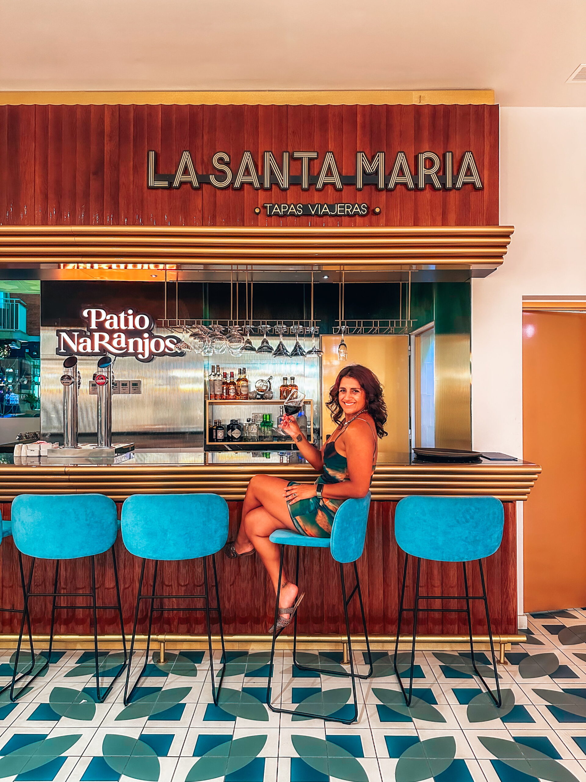 best places to eat in benidorm, girl sits at cocktail bar in benidorm hotel, alicante