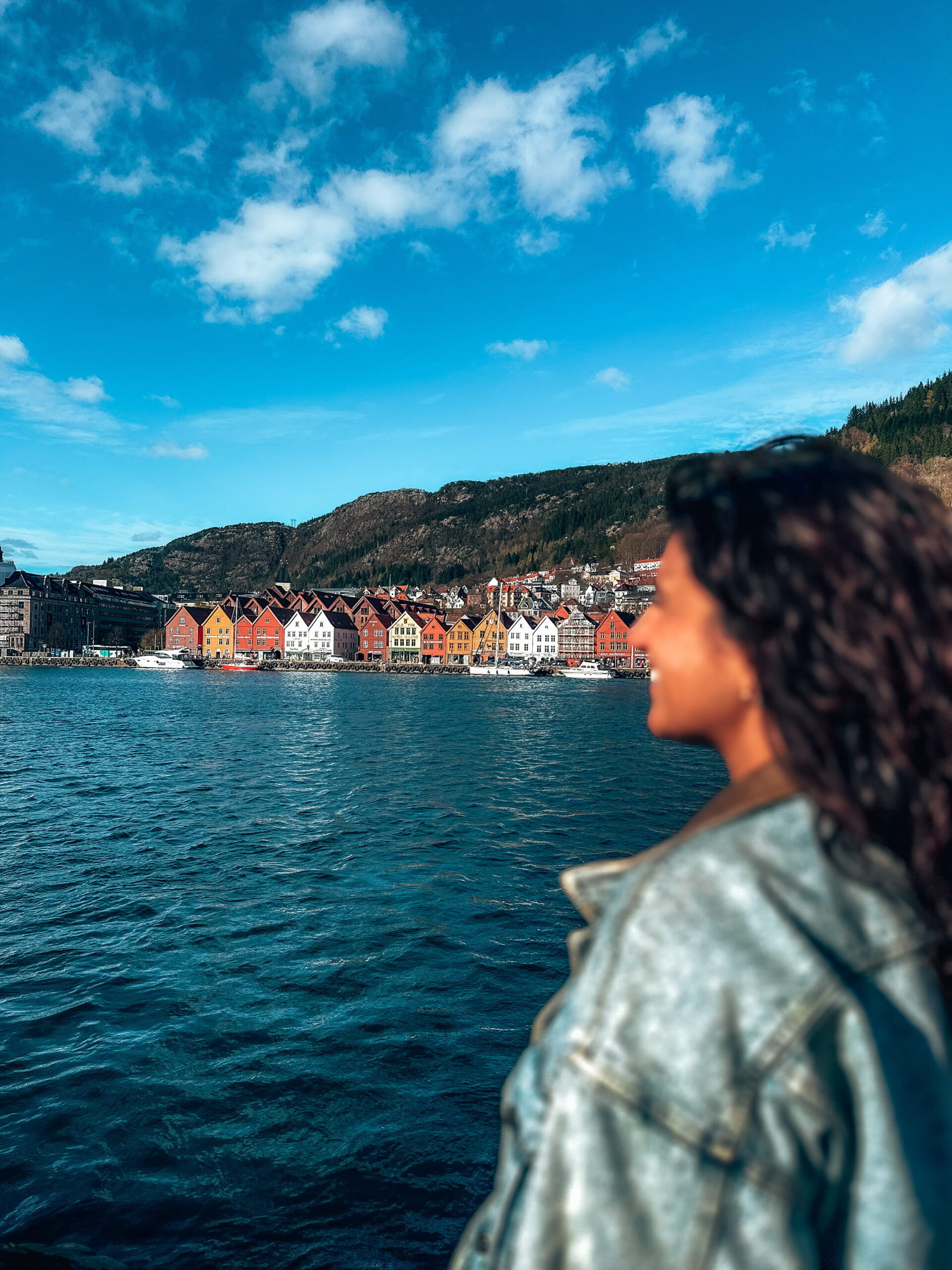 Woman looks at view of Bryggen in bergen norway