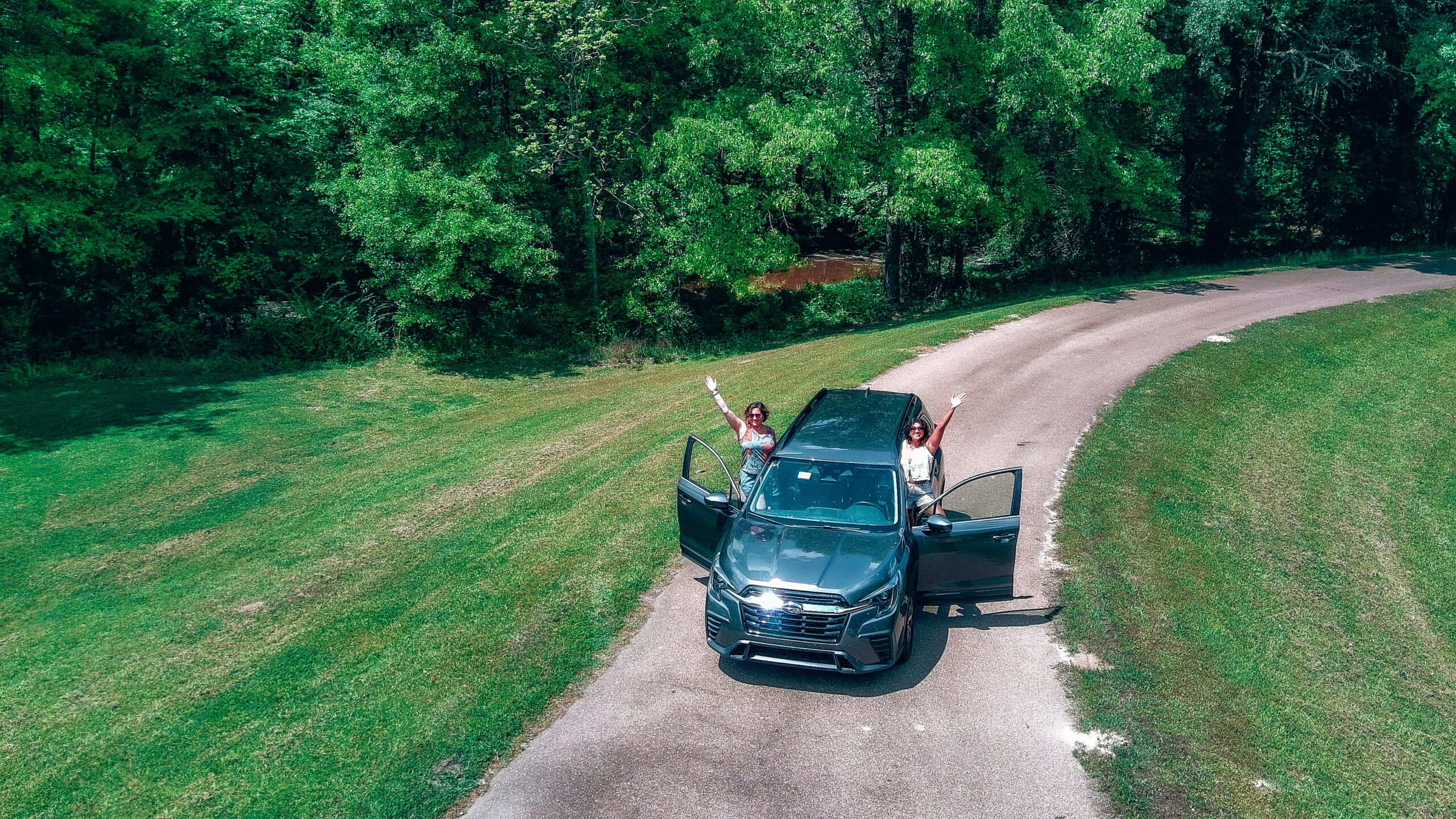 Deep South USA Road Trip - two women pictured with car from drone on the Natchez Trace Parkway - Mississippi and Louisiana itinerary